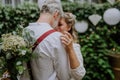 Close-up of bride and groom dancing at their outdoor wedding party. Royalty Free Stock Photo