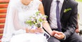 Close-up of bride and groom holding hands Royalty Free Stock Photo