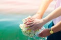 Close-up Bride and groom`s hands with wedding rings and bouquet. Love and marriage. Wedding accessories and decor on the backgrou Royalty Free Stock Photo