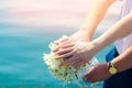 Close-up Bride and groom`s hands with wedding rings and bouquet. Royalty Free Stock Photo