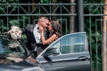 Close up. bride and groom standing near the car Royalty Free Stock Photo