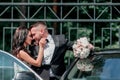 Close up. bride and groom standing near the car Royalty Free Stock Photo