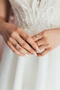 Close-up of the bride`s hands.