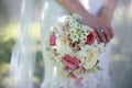 Close up of the bride`s hands holding a bouquet of flowers. Bridal bouquet, hold the wedding bouquet Royalty Free Stock Photo