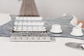 Close up of bridge of white electric guitar, studio shoot.  2 x Single Coil and 1 x Humbucking. Black Pearl pickguard Royalty Free Stock Photo