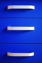 Close up of bright blue modern chest of drawers Royalty Free Stock Photo