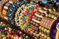 Close up of bright colorful wooden braided bracelets with beads at the street market, Moscow Royalty Free Stock Photo