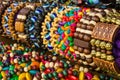 Close up of bright colorful wooden braided bracelets with beads at the street market Royalty Free Stock Photo