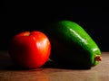 Close-Up of Bright Green Avocado and a Tomato