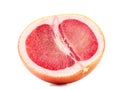 A slice of ripe grapefruit, isolated on a white background. Fresh, juicy, organic and cut in a half grapefruit full of vitamins. Royalty Free Stock Photo