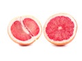 Two slices of ripe grapefruits, isolated on a white background. Fresh, juicy, organic and cut in a halves grapefruit. Royalty Free Stock Photo