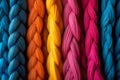 Close-up of bright multi-colored thin African thread braids that are woven into hair and used to create a stylish ethnic