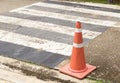 Close up bright orange traffic cones standing in a row on asphalt Royalty Free Stock Photo