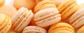 Close-up of bright orange and yellow macaroons.Delicious French pastries. Sweet food background. Generative AI