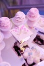 Close-up of bright pink cupcakes on a mirrored stand. Royalty Free Stock Photo