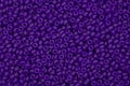 Bright purple seed beads background.