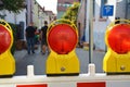 Close up of bright red reflector warning light attached to yellow scaffold at road rerouting Royalty Free Stock Photo