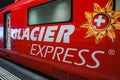 Glacier Express train carriage, red with logo, in Switzerland Royalty Free Stock Photo