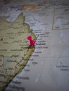 Close up of Brisbane pin pointed on the world map with a pink pushpin Royalty Free Stock Photo