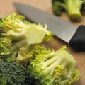 Close up of broccoli florets on wooden table