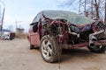 Close up of broken and abandoned car. Smashed car to pieces after accident on street. Concept of careless driving.