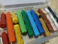 A close up of broken crayons of various colours Royalty Free Stock Photo