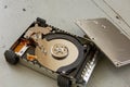 Close Up of Broken and Destroyed Hard Drive Disk on Wooden Table Royalty Free Stock Photo