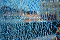 Close-up of Broken Glass, Shattered Tempered glass on Colorful Background. Royalty Free Stock Photo