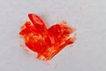 Close up broken heart lollipop on white surface. Royalty Free Stock Photo