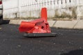 close-up of a broken orange traffic cone after a severe car accident on the road. Royalty Free Stock Photo