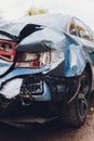 Close up of broken rear tail light of black car with scratches and scuffs. Royalty Free Stock Photo