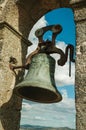 Close-up of bronze bell on top of wall at the Castle of Trujillo Royalty Free Stock Photo