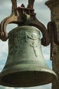 Close-up of bronze bell where can be seen details carved on the surface, at the Castle of Trujillo Royalty Free Stock Photo
