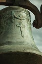 Close-up of bronze bell where can be seen details carved on the surface, at the Castle of Trujillo Royalty Free Stock Photo