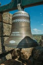 Close-up of bronze bells on top of stone brick wall Royalty Free Stock Photo