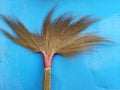 Broom head on blue wall