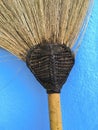 Broom head on blue wall