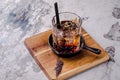 Close up, brown alcoholic cocktail with whiskey, ice cubes decorations on a wooden board, gray background. Bar alcohol Royalty Free Stock Photo