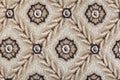 A close-up on a brown and beige seamless carpet print with floral pattern