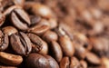 Close up brown and black roasted coffee beans or grains background Royalty Free Stock Photo