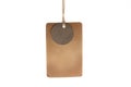 Close-up of brown Blank label tied with brown rope on white background. mockup Royalty Free Stock Photo