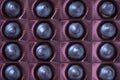 Close up brown chocolate candy background. Assortment of chocolate candies sweets in the box Royalty Free Stock Photo