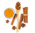 Close up the brown cinnamon stick and powder with star anise spice in wooden spoon isolated on white background Royalty Free Stock Photo