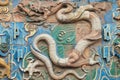 Close up of the brown dragon on the nine dragon wall
