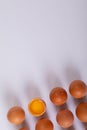 Close-up of brown eggs with one broken egg on table with blank space Royalty Free Stock Photo