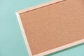 Brown corkboard for notes on a green background