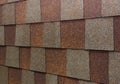 A close-up on brown and gray asphal roof shingles when choosing the right roof shingle color Royalty Free Stock Photo