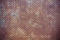Close up of grunge rusty diamond metal plate abstract background