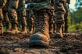 Close up of brown leather army boots marching on the ground during a training exercise in a forested area at sunset Royalty Free Stock Photo