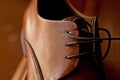 A close up brown leather men`s dress shoes and laces Royalty Free Stock Photo